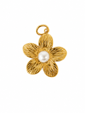 Flor dorada con perla